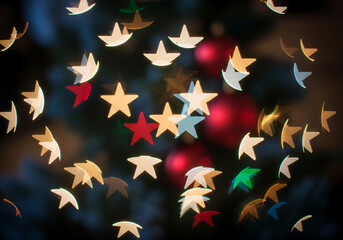 Seamless pattern illustration of red stars on a black background perfect for a bold holiday decoration design or a unique vector backdrop texture