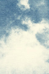 Vertical Macro Halftone Print of Blue Sky and Clouds