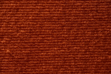 Close-Up of Rust-Colored Corduroy Fabric Texture