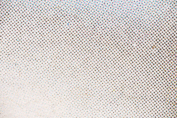 Extreme Close-Up of CMYK Halftone Dots on White Paper