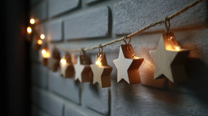 Wooden star garland with warm lights hanging on a textured wall