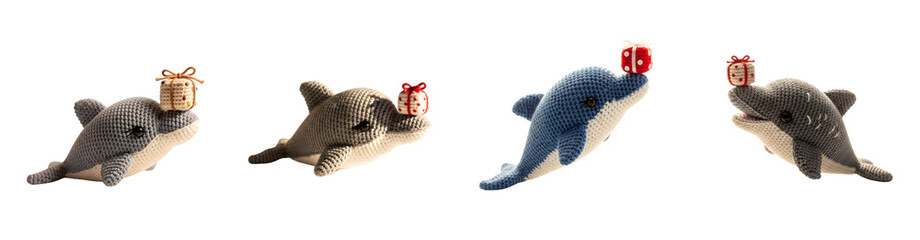 Obraz premium Four crocheted dolphins with presents on noses isolate handmade toy plush