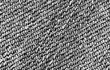 Close-up of diagonal woven twill textile pattern with bold contrast.