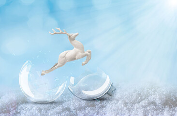 A deer leaps towards light and freedom from a broken glass cristmas ball