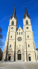 Fototapeta premium Front view of Ambrosius Church in Magdeburg, showcasing its historic brick façade and architectural symmetry.