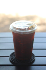 Iced black coffee on the camping table