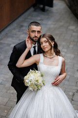 Couple celebrates their wedding day in a charming outdoor setting in a quaint town