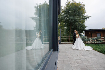 Couple shares a romantic moment during their wedding ceremony at an outdoor venue