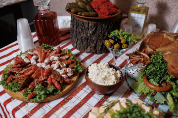 Delicious spread of seafood, pickles, and cheeses at a festive gathering in a cozy setting