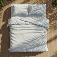 A neatly made white bed, featuring two plush pillows and a crisp duvet, is positioned on a light wooden floor under bright sunlight, casting elegant palm shadows.