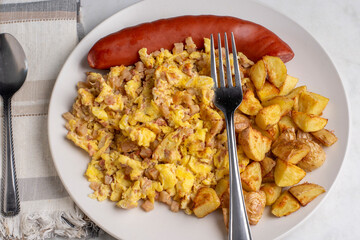 scramble eggs and corn beef hash  with  smoked sausage