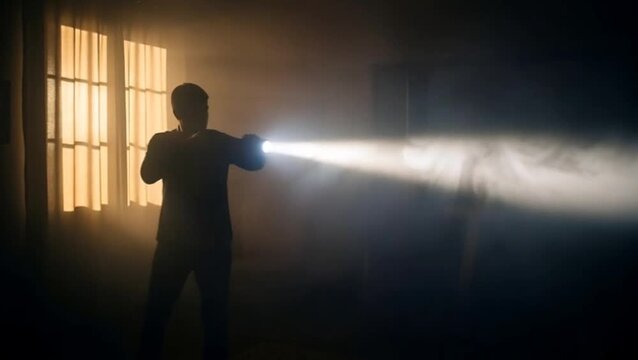 Silhouette man holding flashlight inside dark dusty room with strong light beam cutting through mysterious smoky cinematic atmosphere
