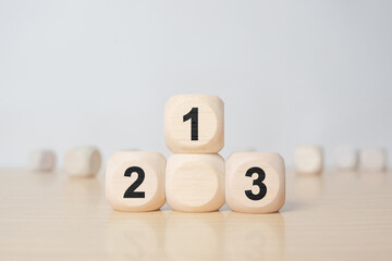 Wooden blocks stacking as a podium on white background. Success, win, winner, victory or top ranking concept.