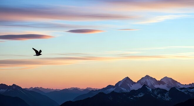A silhouette of a bird flying over a mountain range at sunset. The sky is filled with colorful clouds. - Powered by Adobe