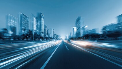 Streaking lights on a busy highway with blurred city skyline