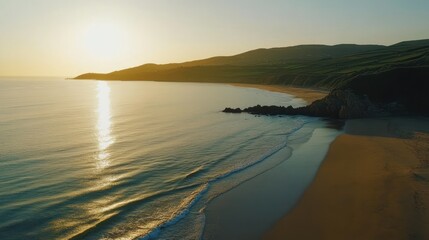 Golden Hour at the Coast: Sun Reflects on the Sea and Beach, serene landscape