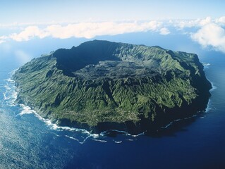 Aerial View of a Volcanic Island with Lush Green Slopes and a Caldera Crater Surrounded by the Ocean