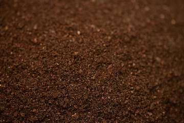Texture and surface of soil mixed with manure background.