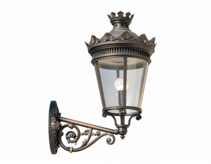 A vintage, dark metal outdoor wall lantern with clear glass panels. The light fixture is mounted on a decorative, scrolling arm. It features a regal, crown-like top detail.