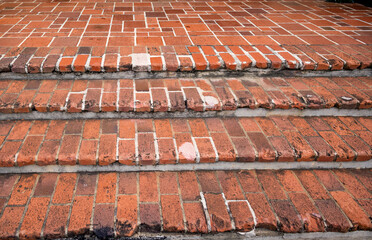 Old Weather Beaten Red Brick Steps.