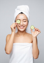 young blonde woman with facial mask