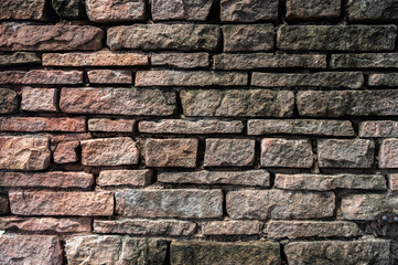 Naklejka premium An old brick wall textured and pattern. A brick is a type of block used to build walls.