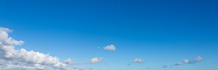 Deep Blue Sky with White Clouds, background.