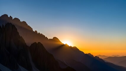Stunning sunrise crests jagged mountain peaks casting dramatic light rays across a vast, serene alpine landscape