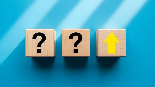 Three wooden blocks showing two question marks and one upward arrow - Powered by Adobe
