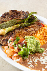 A closeup view of a carne asada plate.