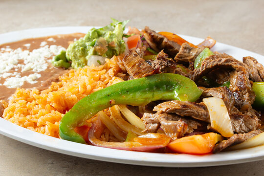 A closeup view of a plate of bistec ranchera.