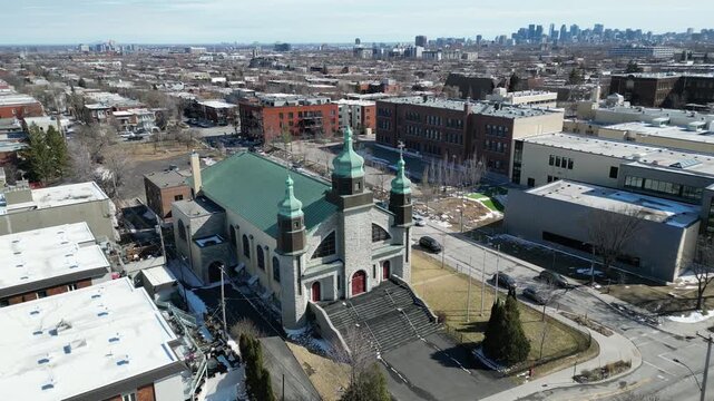 Aerial view of Assumption of the Blessed Virgin Mary Catholic Church in Montreal on a clear winter day. g.