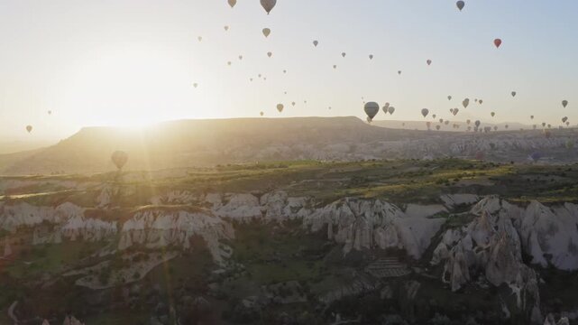 Hot air balloons flying over the valley at sunrise, Cappadocia, Turkey
