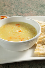 A view of a bowl of avgolemeno soup.
