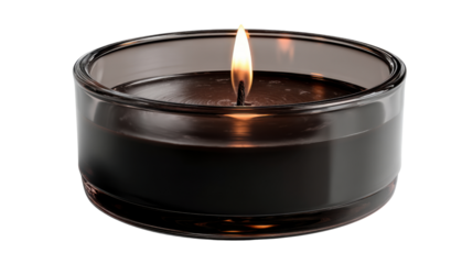 Black wax candle glowing with a soft flame inside a round glass jar. Object isolated on transparent background for easy use