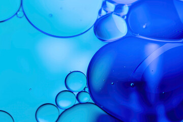 Macro Close-up of Teal and Cyan Oil Drops and Bubbles on Water, Creating an Abstract and Dynamic Background. Fluid texture with intricate details ideal for science, beauty, or technology concepts.