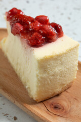 A view of a strawberry cheesecake slice.