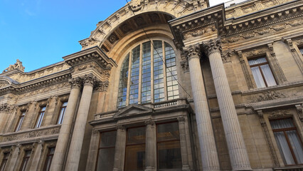 Naklejka premium BRUSSELS, BELGIUM - NOVEMBER 26, 2025 - Bourse de Bruxelles building facade with neoclassical architecture and columns in Brussels, Belgium