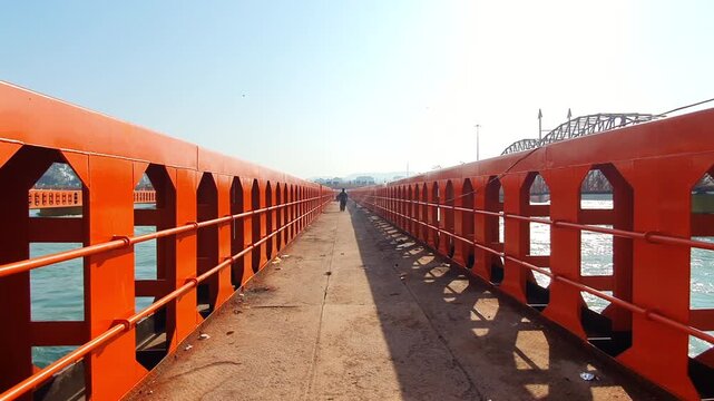 Bridges ganga river in Haridwar Kumbh mela. Ganga water is used by hindu pilgrimage in Dehradun Uttarakhand. Water is blue and flows very fast.