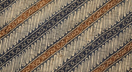Close-up of a traditional batik fabric with diagonal stripes in shades of brown, beige,