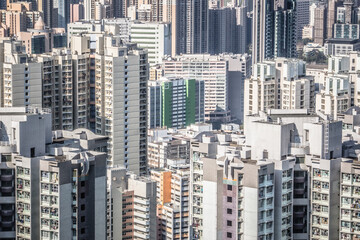 Fototapeta premium A dense urban landscape with high-rise residential buildings of varied styles and heights, showing modern city development.