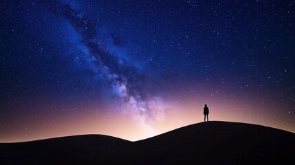 Silhouette of a person gazing at the Milky Way