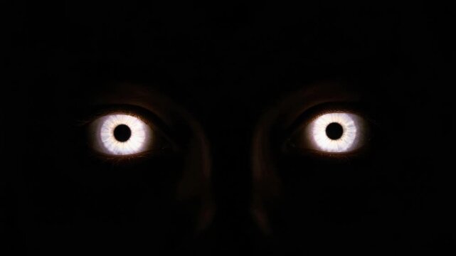 Creepy eyes glowering in the abyss, a disconcerting visual experience that evokes anxiety and unease