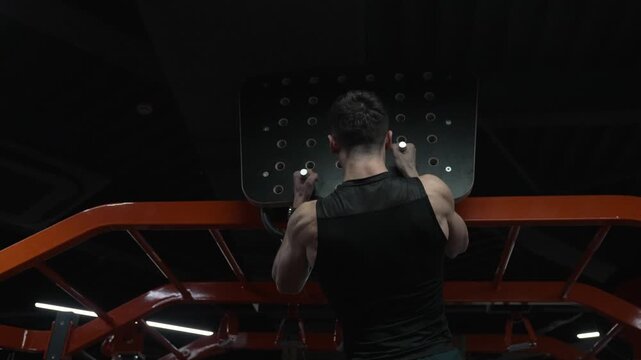 Man pullup at gym equipment. Muscular man sportsman with strong back muscle. Sport pullup workout. Sport training. Man sportsman do pullup exercise. Muscular biceps and triceps. Strong athlete