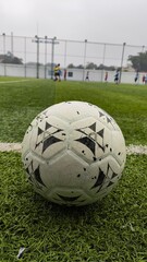 The ball is ready to be kicked and the game begins.