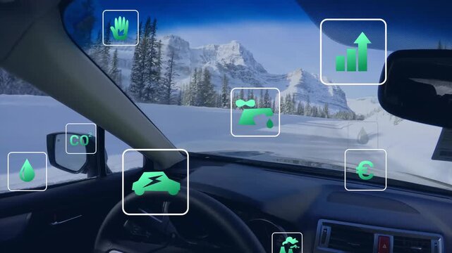 Car interior view with superimposed green icons of sustainability set against snowy mountain scenery