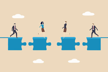 Business team connecting puzzle pieces to bridge the gap to success