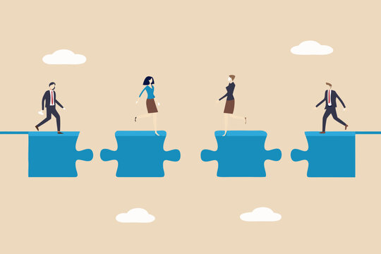 Business team connecting puzzle pieces to bridge the gap to success