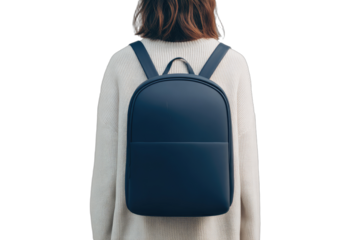 Person wearing a cream sweater with a minimalist navy backpack
