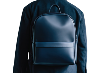 A person from behind wears a sleek, minimalist navy blue backpack